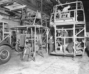 men working on bus frame